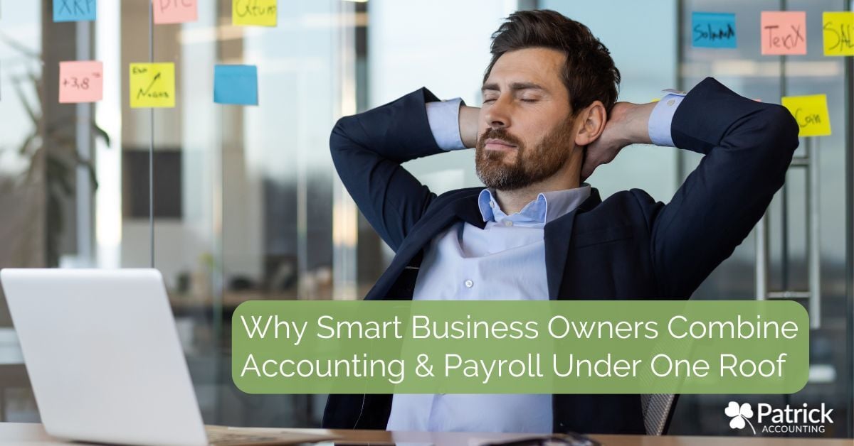 Businessman in suit sitting at desk with laptop and smartphone, relaxing with hands behind head because he is confident in his decision to bring accounting and payroll under one roof. Blog title 