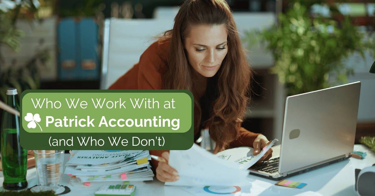thriving business owner looking at financial documents on desk