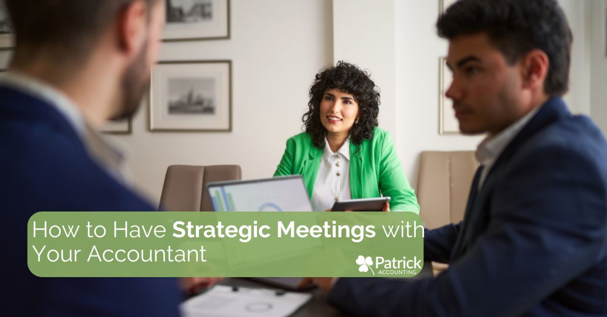 Two professionals meet with an accountant in a bright office. The accountant, wearing a green jacket, smiles while discussing documents. Text overlay reads, 