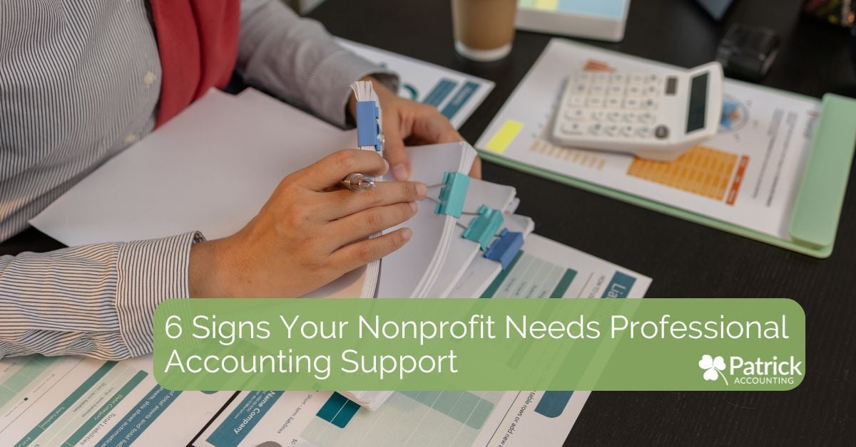 Photo of a person reviewing financial documents with binders, a calculator, and charts on a desk. Green banner text reads: 