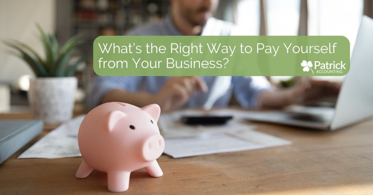 Pink piggy bank on desk with business owner calculating finances. Blog title with Patrick Accounting logo reads: 