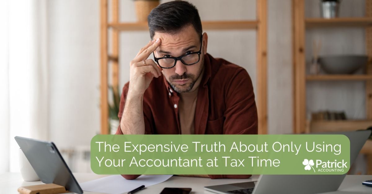 Stressed business owner looking over the top of his glasses frustrated and reviewing finances at laptop. Blog title with Patrick Accounting logo reads: 
