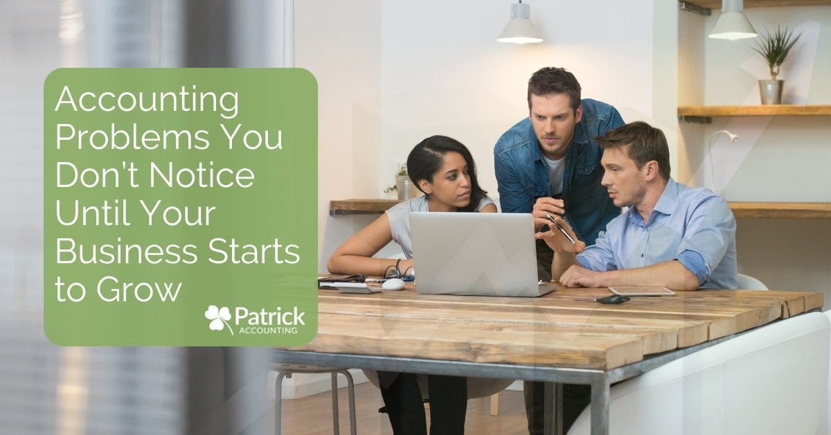 Business team reviewing financial data on a laptop with overlay text, 