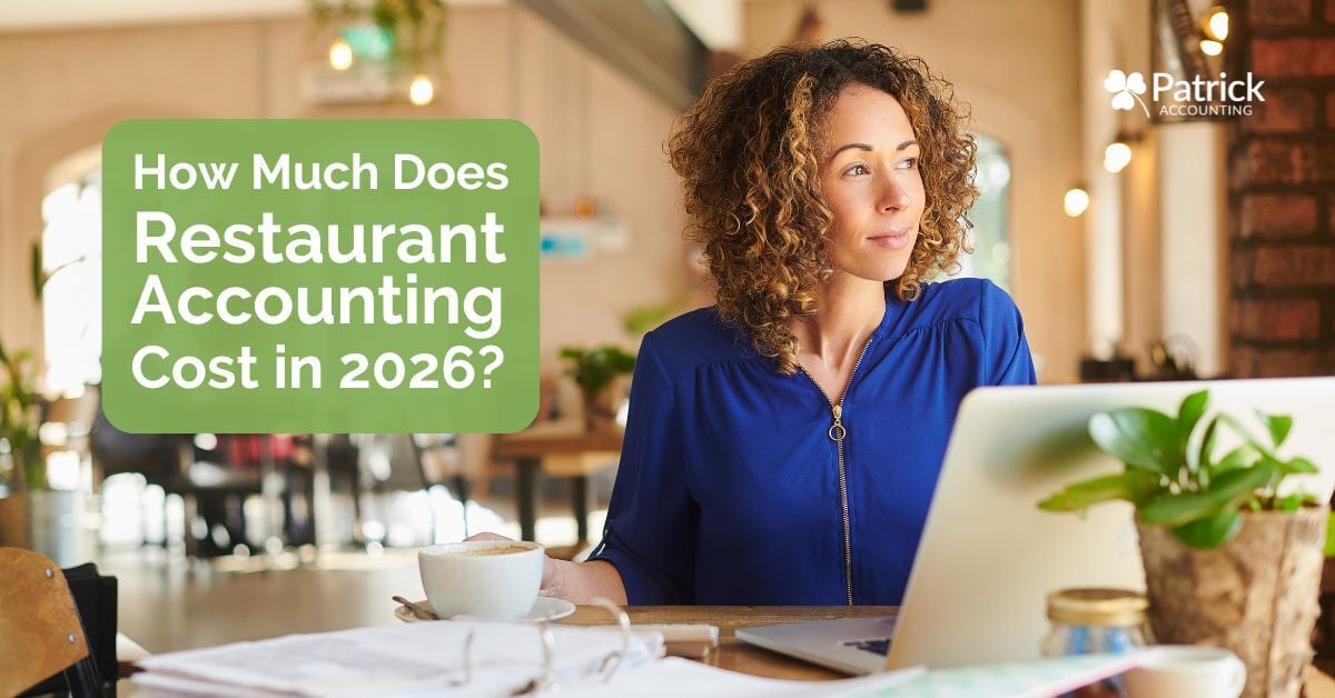 Restaurant business owner using laptop and reviewing finances, highlighting restaurant accounting services costs for 2026.
