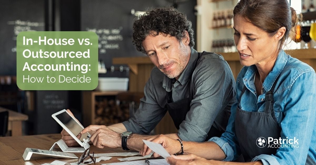 Patrick Accounting-branded blog thumbnail image with two business owners looking at a tablet and paperwork trying to decide if they should hire an in-house bookkeeper or outsource their accounting to a firm.
