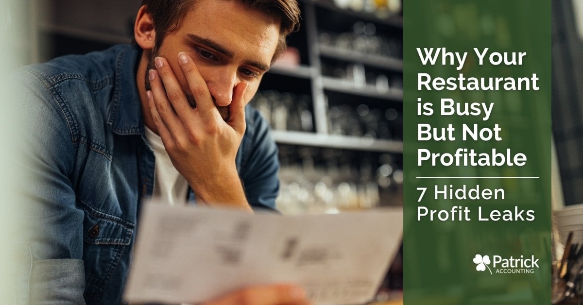 Restaurant owner reviewing finances and feeling stressed about why the restaurant is busy but not profitable.